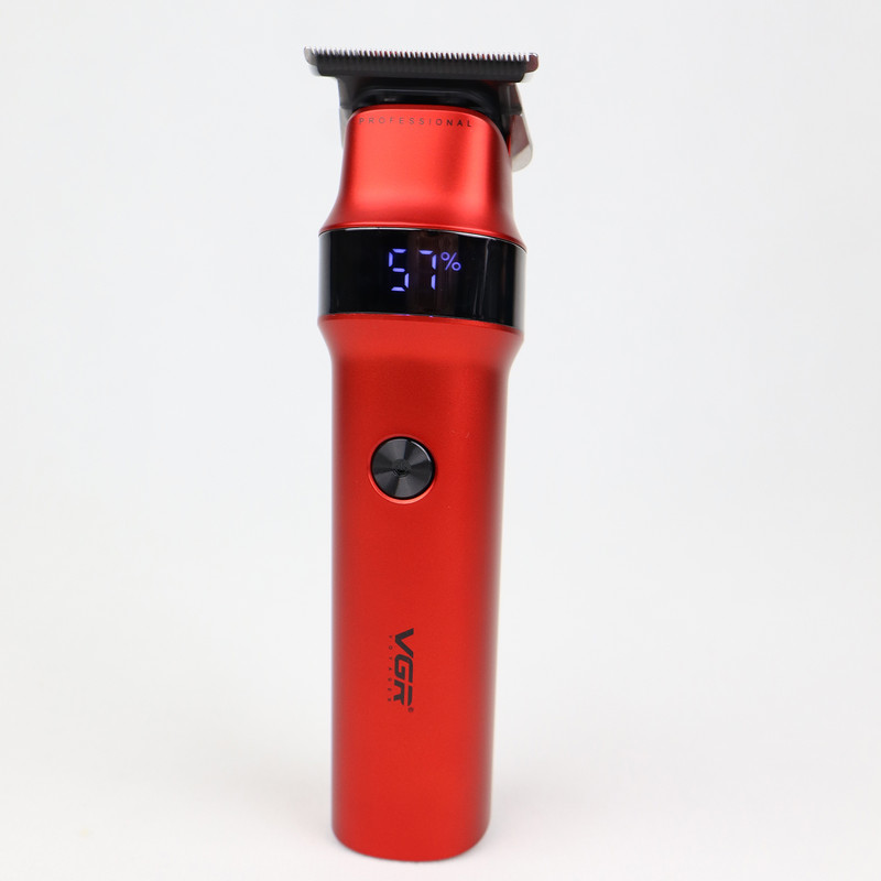 ماشین اصلاح موی سر و صورت وی جی ار مدل V-987 با تیغه استیل ضد زنگ، عملکرد توربو، قابلیت اصلاح با شماره صفر، نمایشگر میزان شارژ، طراحی ارگونومیک، همراه با سه شانه راهنما و برس تمیزکننده